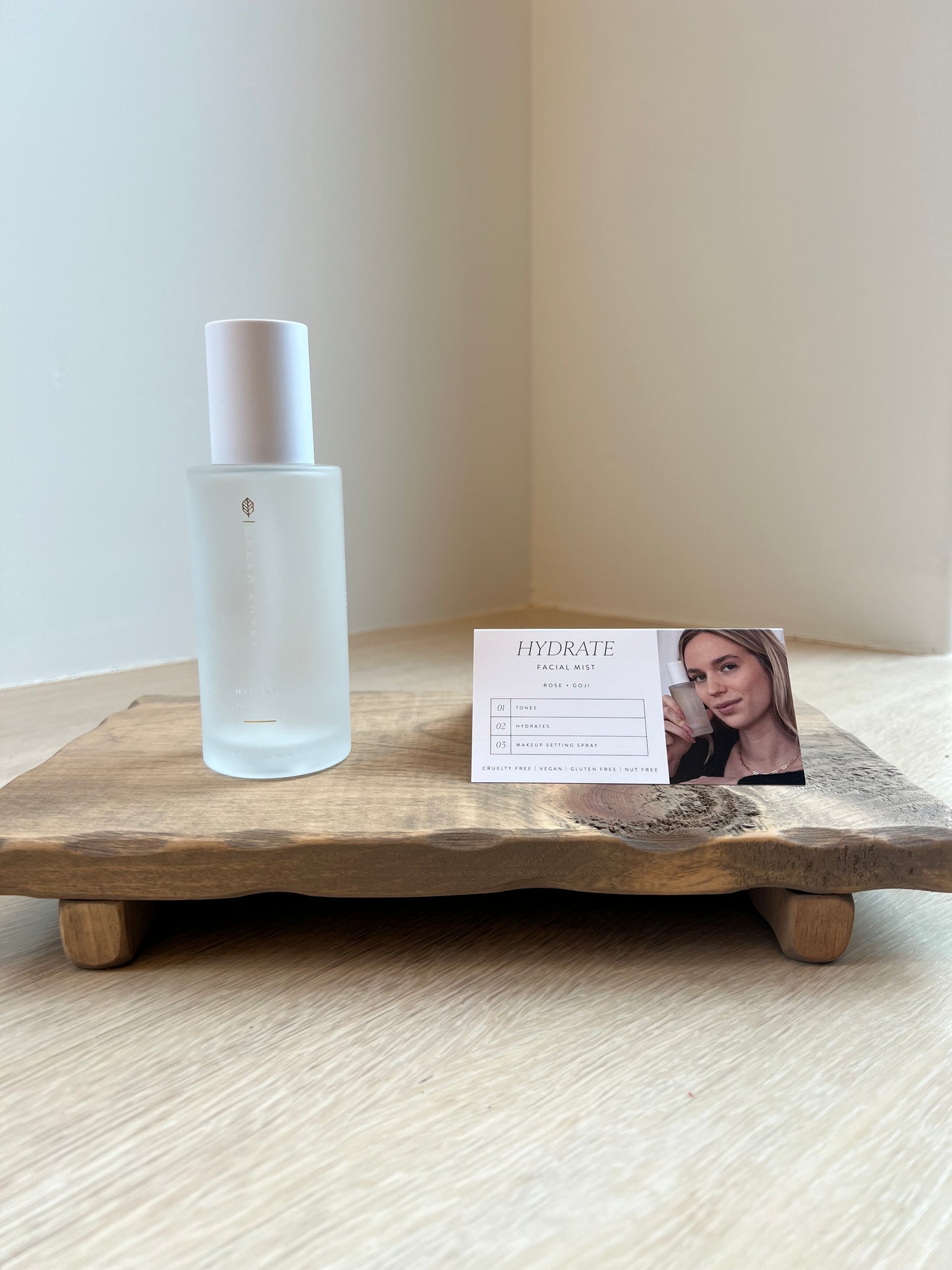 Hydrate Facial Mist on a wooden surface with a blurred background