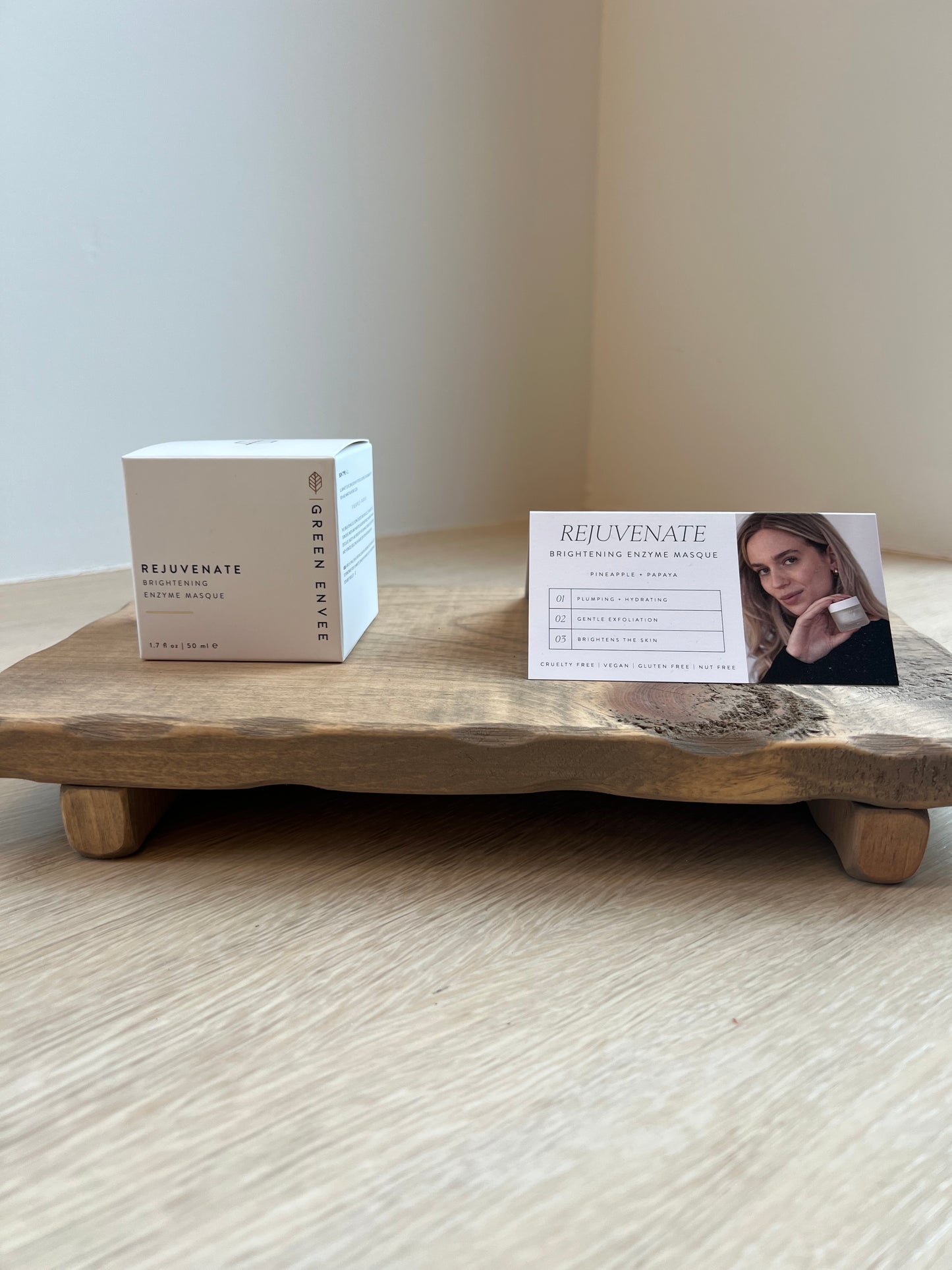 Two boxes of Green Envy on a wooden surface with a blurred background
