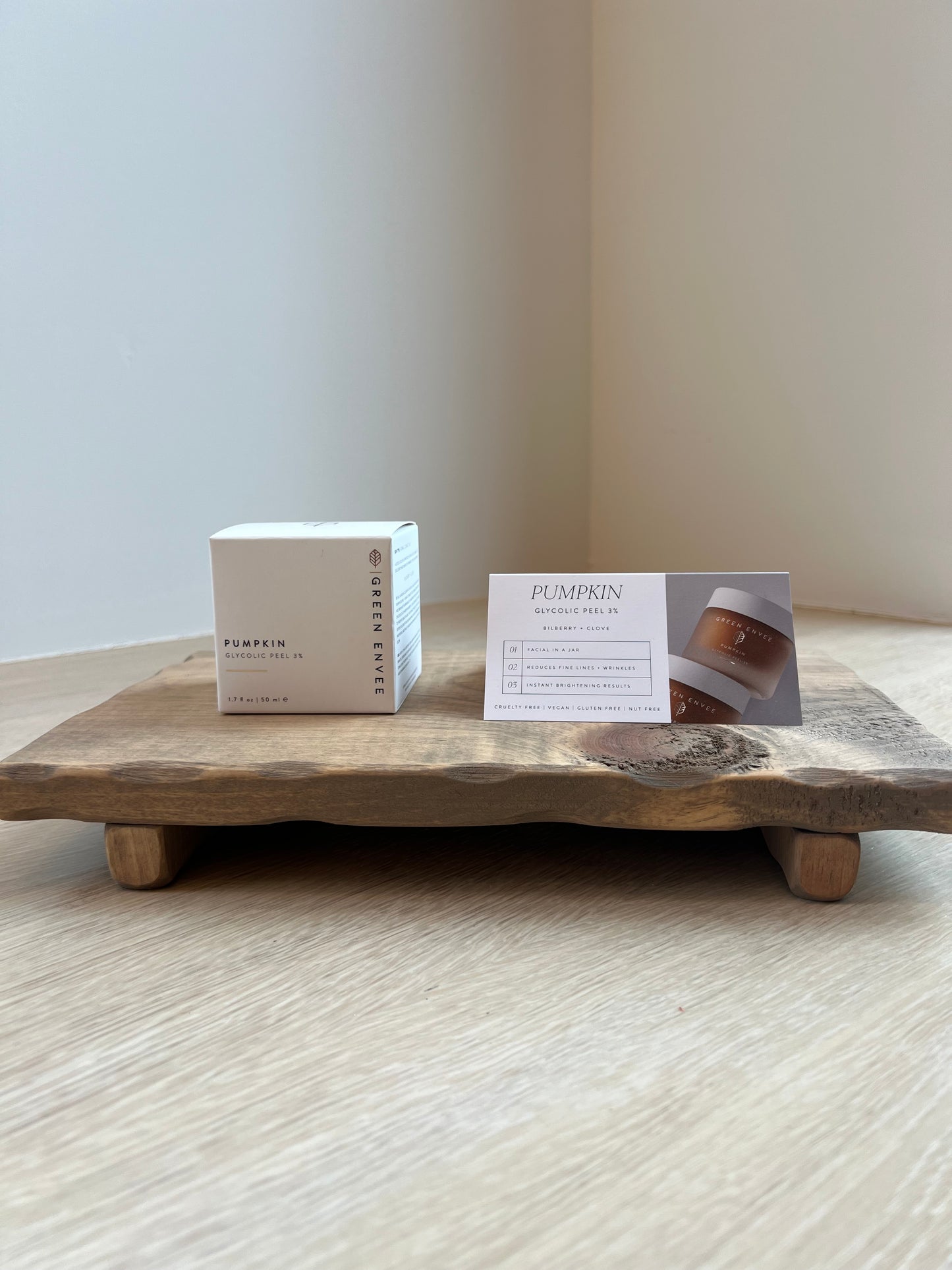 Green Envee pumpkin glycolic peel on wooden riser