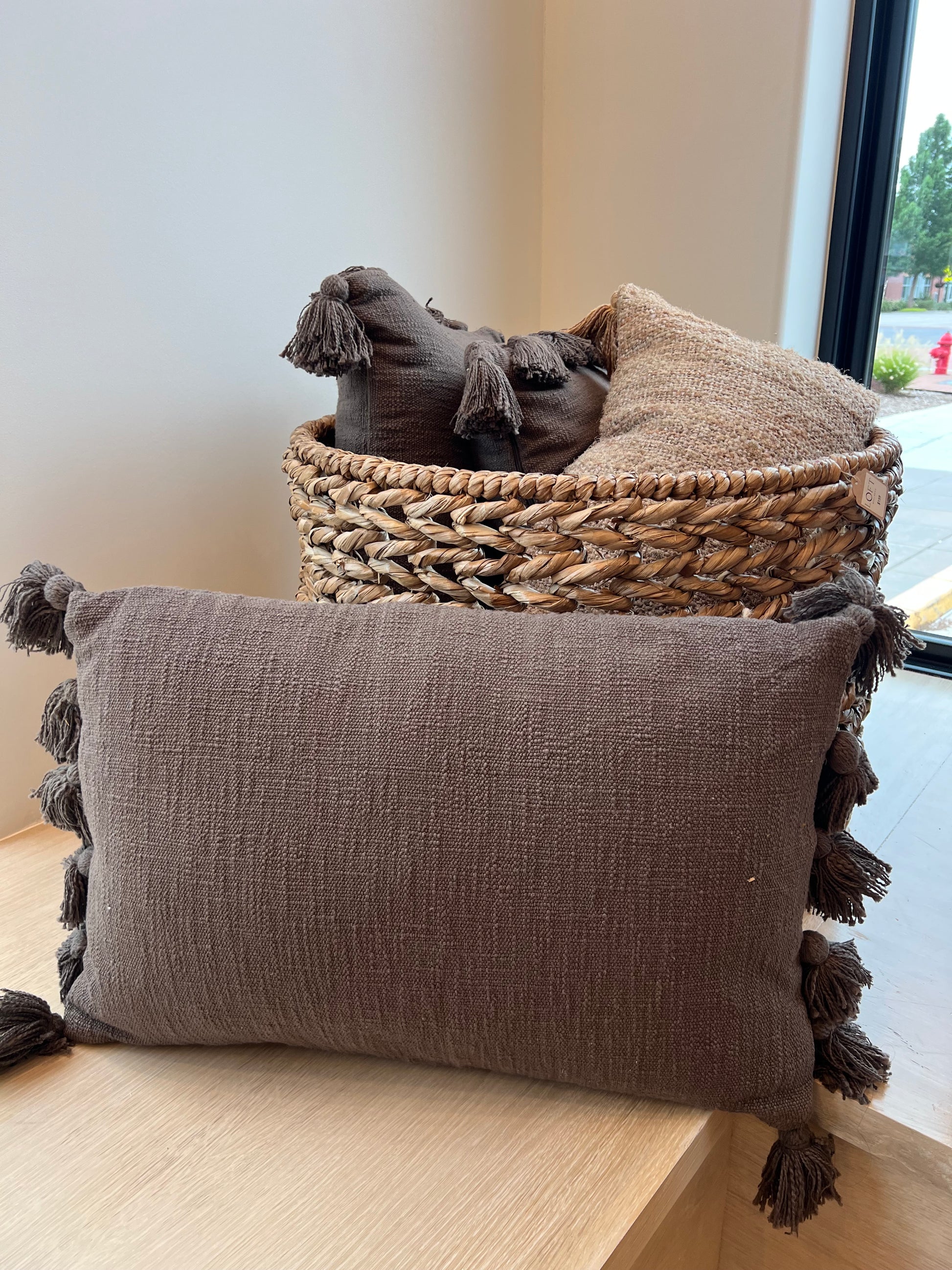 grey, tassled couch pillow