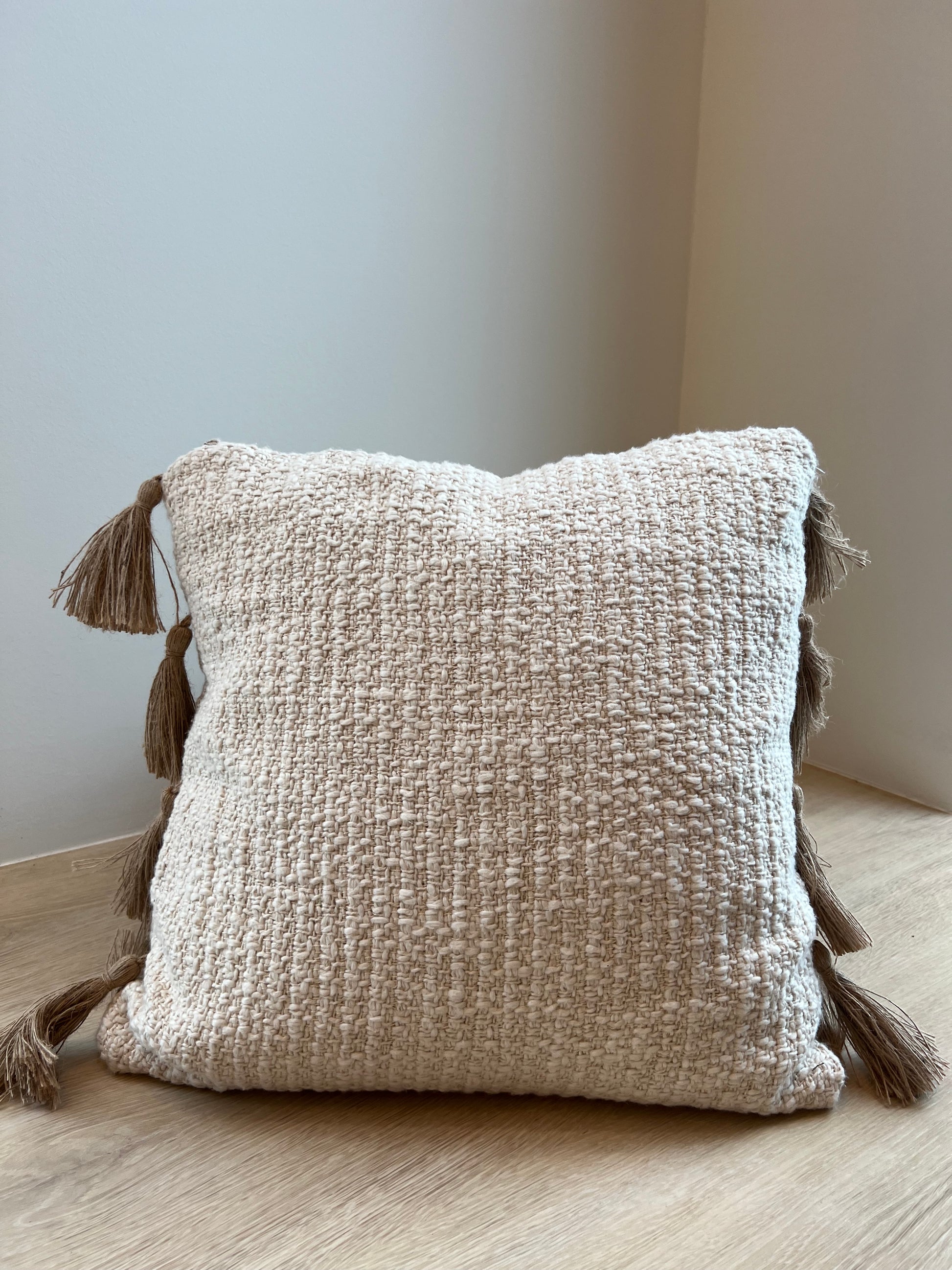 tan, tassled, couch pillow