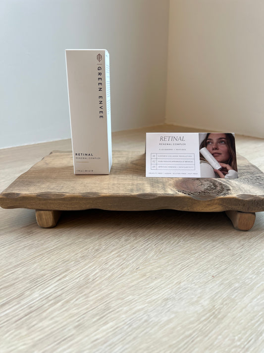 Wooden tray with a product box labeled 'Green Envee' on a light wooden surface.