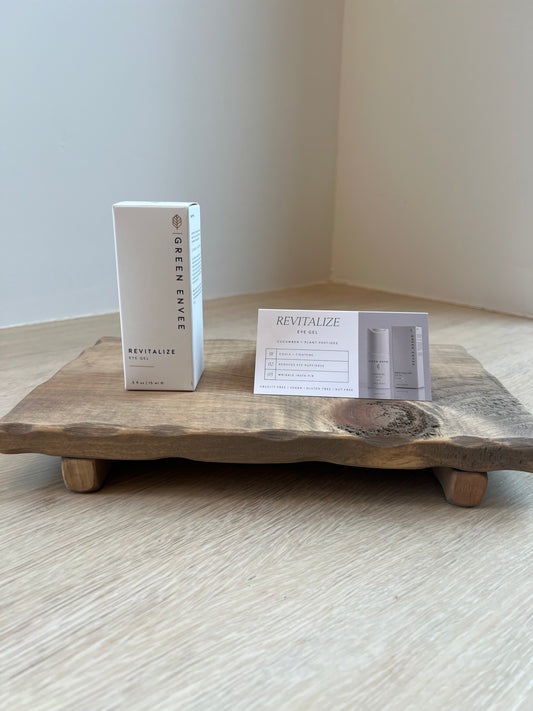 Revitalize Eye Gel from Green Envee product box on wooden tray