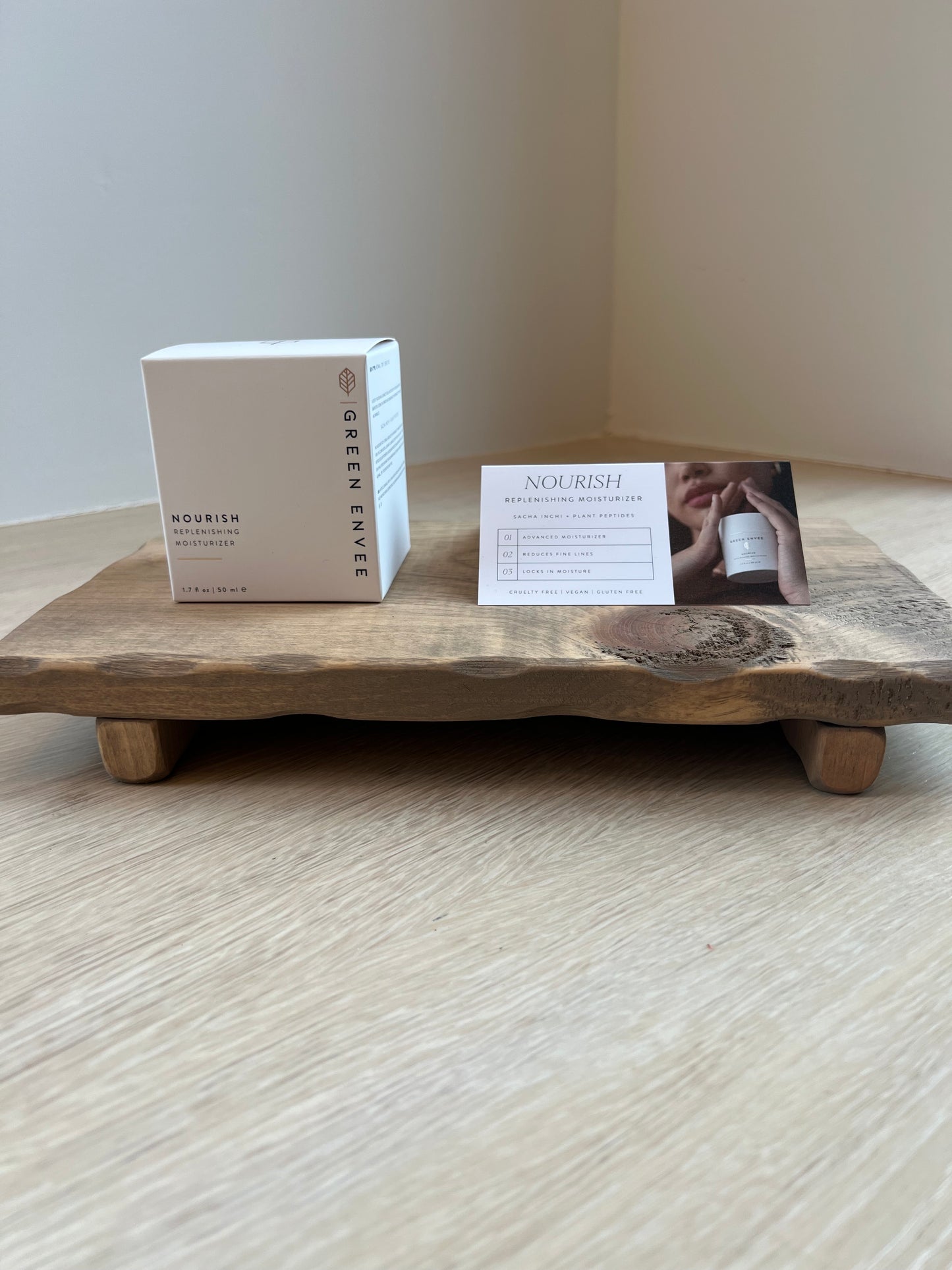 Nourish Replenishing Moisturizer on wooden riser